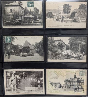 several black and white photographs of old buildings in a display case