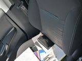 a car seat that has a bunch of papers in it
