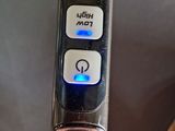 a close up of a remote control on a couch
