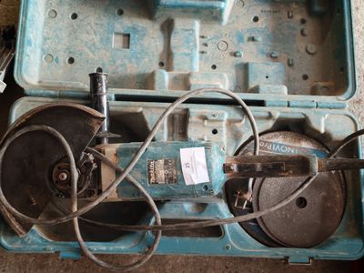 a blue tool box with tools in it on the floor