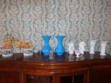 three vases sitting on top of a wooden table