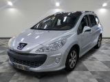 the small silver car is parked in a large room