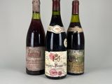 trois bouteilles de vin posées l'une à côté de l'autre sur une table