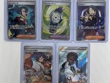 six card set of pokemon trading cards in plastic cases on a white surface