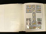 an open book with pictures on it on a table