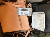 a lot of purses that are sitting on a table