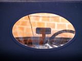 a reflection of a car in the window of a car