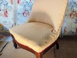a chair that is sitting in the middle of a room