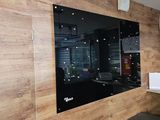 a picture of a kitchen with a large mirror on the wall