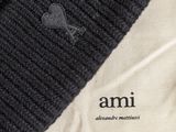 a knitted beanie hat on top of a t - shirt