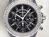 the watch is black and has a diamond bezeled bezel