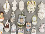 a lot of ornaments that are hanging on the wall