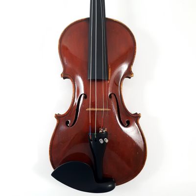 a violin that is sitting on a stand on the wall