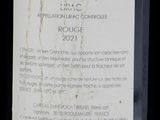 a label on a bottle of wine on a table