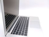 a close up of a laptop computer on a white surface