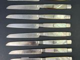 a set of seven knives with mother of pearl inlays