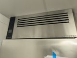 a stainless steel stove top with a blue tape on it