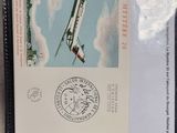 a black wallet with a picture of a plane on it