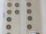 a lot of coins in a plastic bag on a table