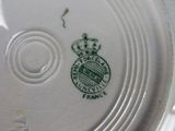 a close up of a plate with a crown on it