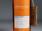 a bottle of liquor with a price tag on it