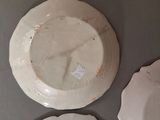 three plates that are sitting on a table