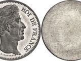a close up of a coin on a white background