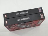 two boxes of avengers comics are stacked on top of each other