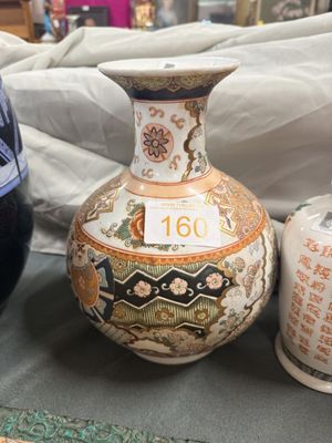 two vases that are sitting on a table