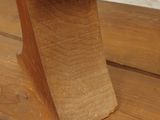 a wooden bench that has a wooden seat on top of it