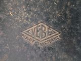a close up of a metal object with a diamond on it