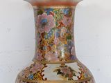 a vase that is sitting on a table with a white background