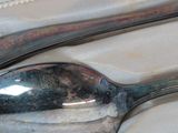 a spoon and a spoon rest on a table