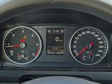 a close up of a car dashboard with a speedometer and a steering wheel