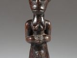 an image of a statue of a woman holding a baby