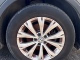 a close up of a car ' s tire on the street
