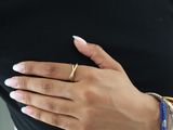 a woman with a ring on her left hand and a ring on her right hand