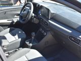 the interior of a car with the driver ' s seat down