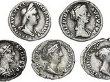 four ancient roman coins, one of which has a head of a woman and one of which is a man