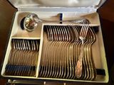 silverware in a case with spoons, forks, and spoons in it
