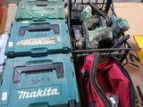 several makita tools are sitting on top of a box in a warehouse