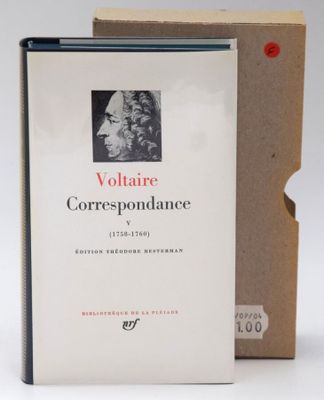 a book that is sitting on a table next to a box