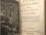 an old book opened to show a picture of a man and a woman