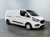 the white van is parked in a room with a gray floor