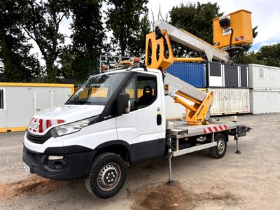 a white truck with a crane on the back of it