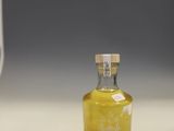 a small bottle of alcohol sitting on a counter