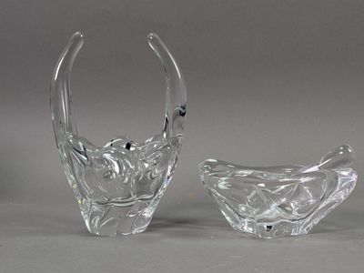two clear glass vases sitting next to each other