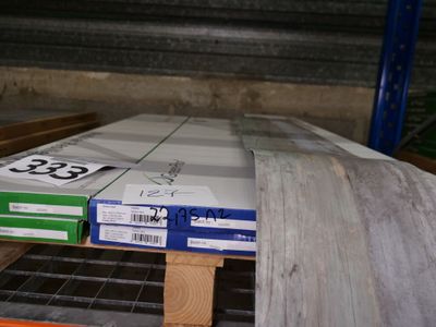 a stack of boxes sitting on a pallet in a warehouse