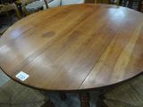 a wooden table with a label on it in a store