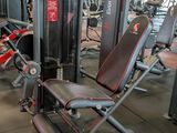 a gym with a lot of machines in the room